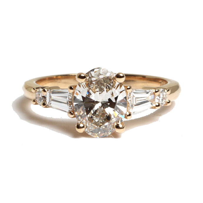 oval cut diamond ring with two tapered baguettes