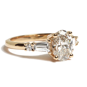 oval cut diamond ring with two tapered baguettes