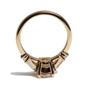 oval cut diamond ring with two tapered baguettes